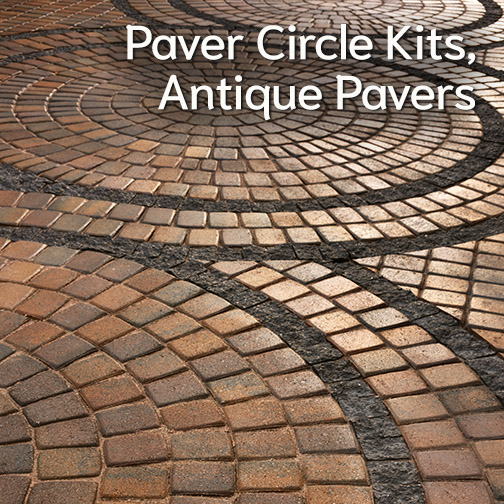 A set of three Circle Kits expanded to larger size and connected with a double row of rough edged black cut pavers. Those rows are seperated by additional two rows of standard pavers. The imaged is cropped to show most of the large center circle and just a section on the adjoining cercles to the forground and background of the image.