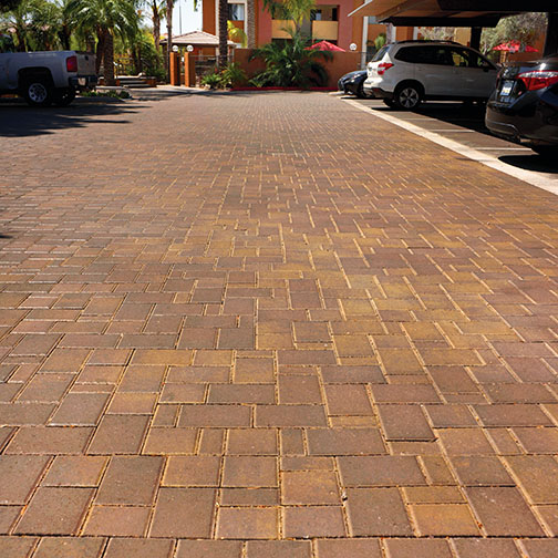 Photo of townscapepavers in parking lot laine at apartment complex. Territorial color set.