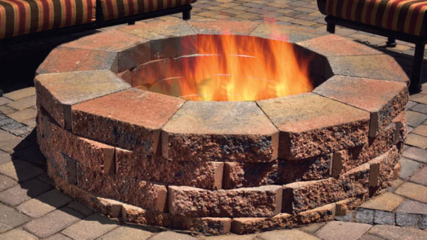 A fire burning in a round firepit