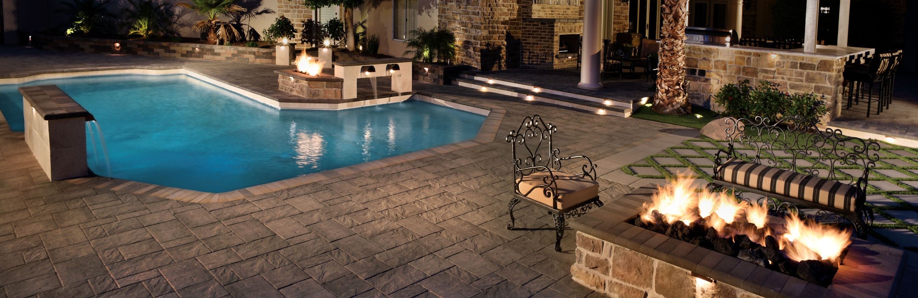 Aztec Stone andcoping in slate color at poolside in night photograph